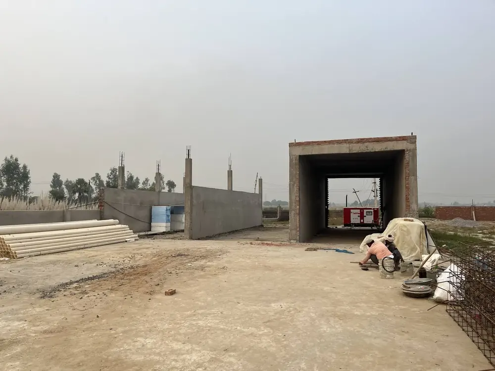 A MushroomWale compost yard under construction: the Phase-I bunker walls and the Phase-II tunnel
