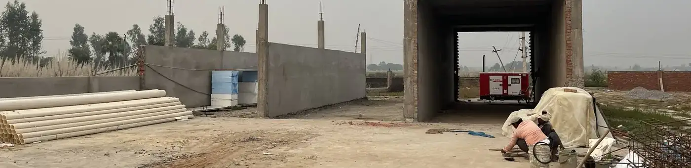 A MushroomWale compost yard under construction: the bunkers and the tunnel