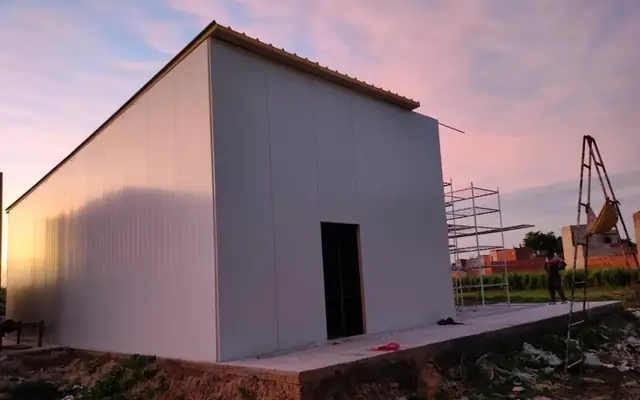 A MushroomWale PUF panel room at dusk