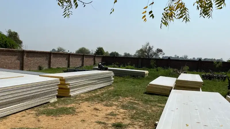 PPGL PUF panels stacked on a MushroomWale site before erection